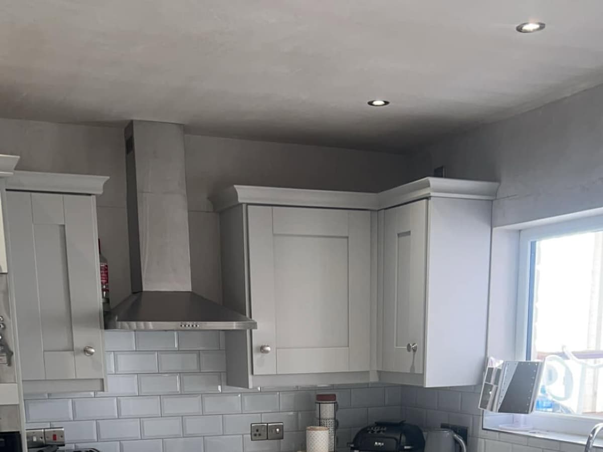 After: new grey shaker kitchen with metro-tile splashback and marble-effect floor